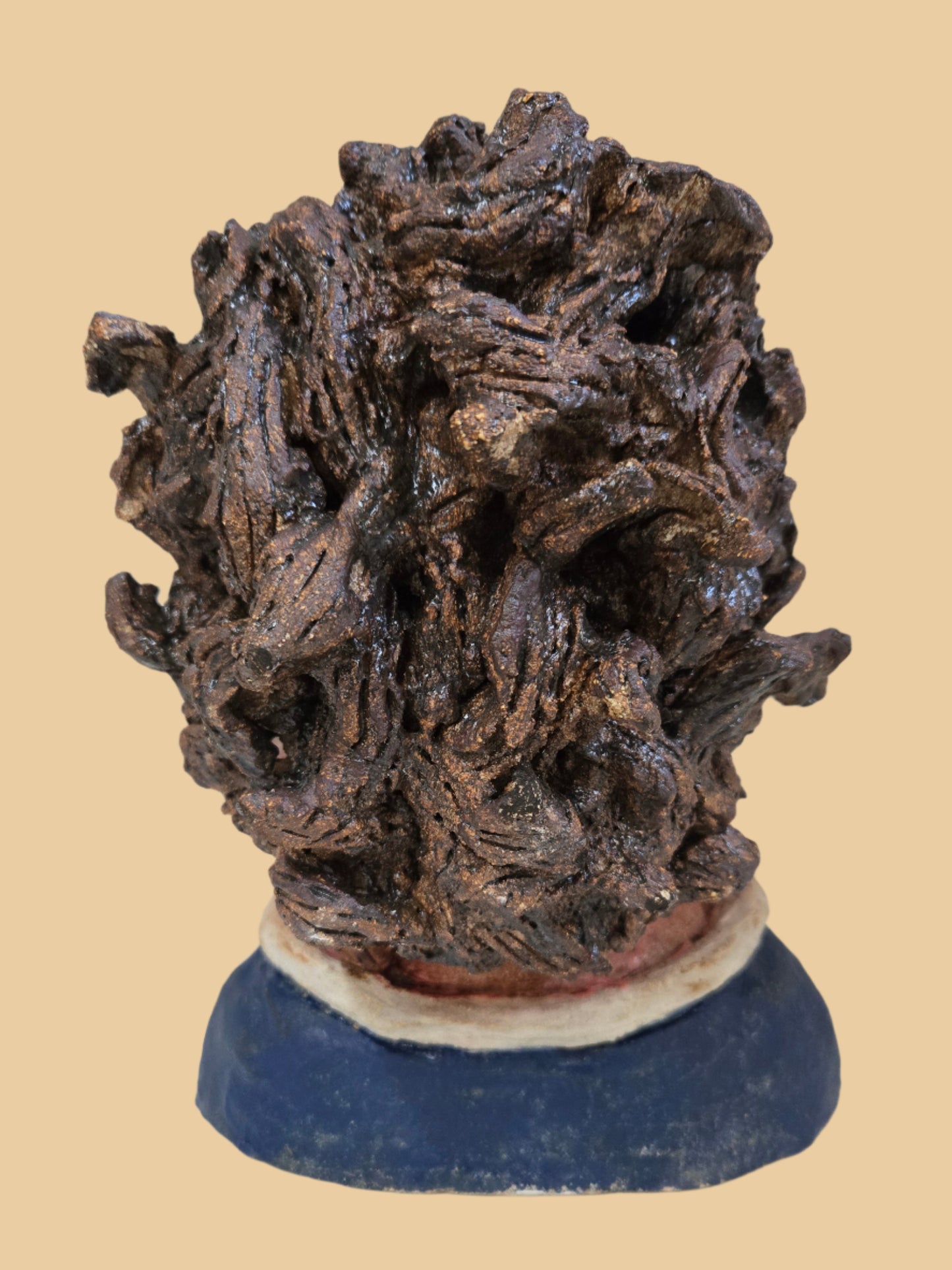 Textured head with a blue base on a white background