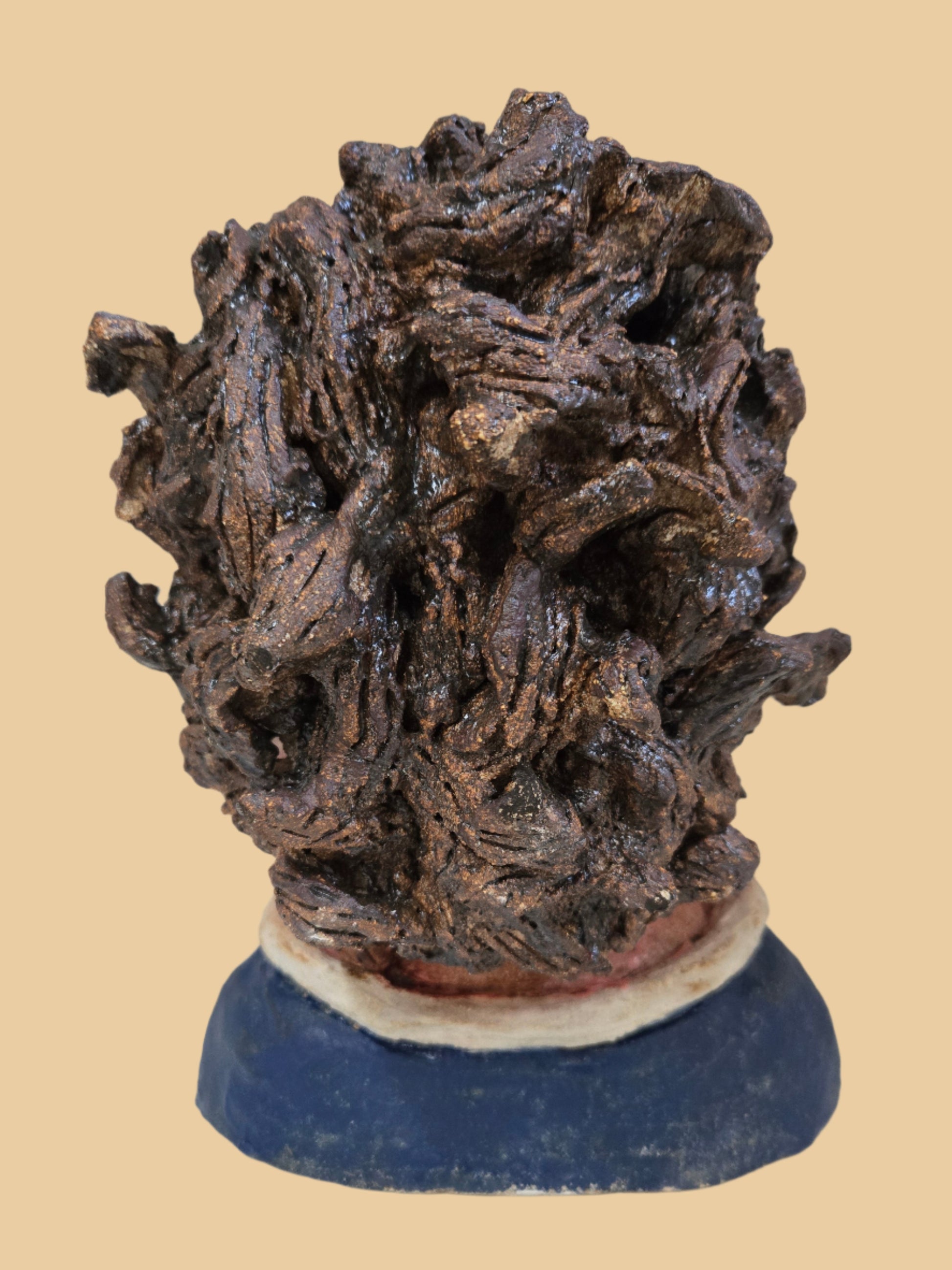 Textured head with a blue base on a white background