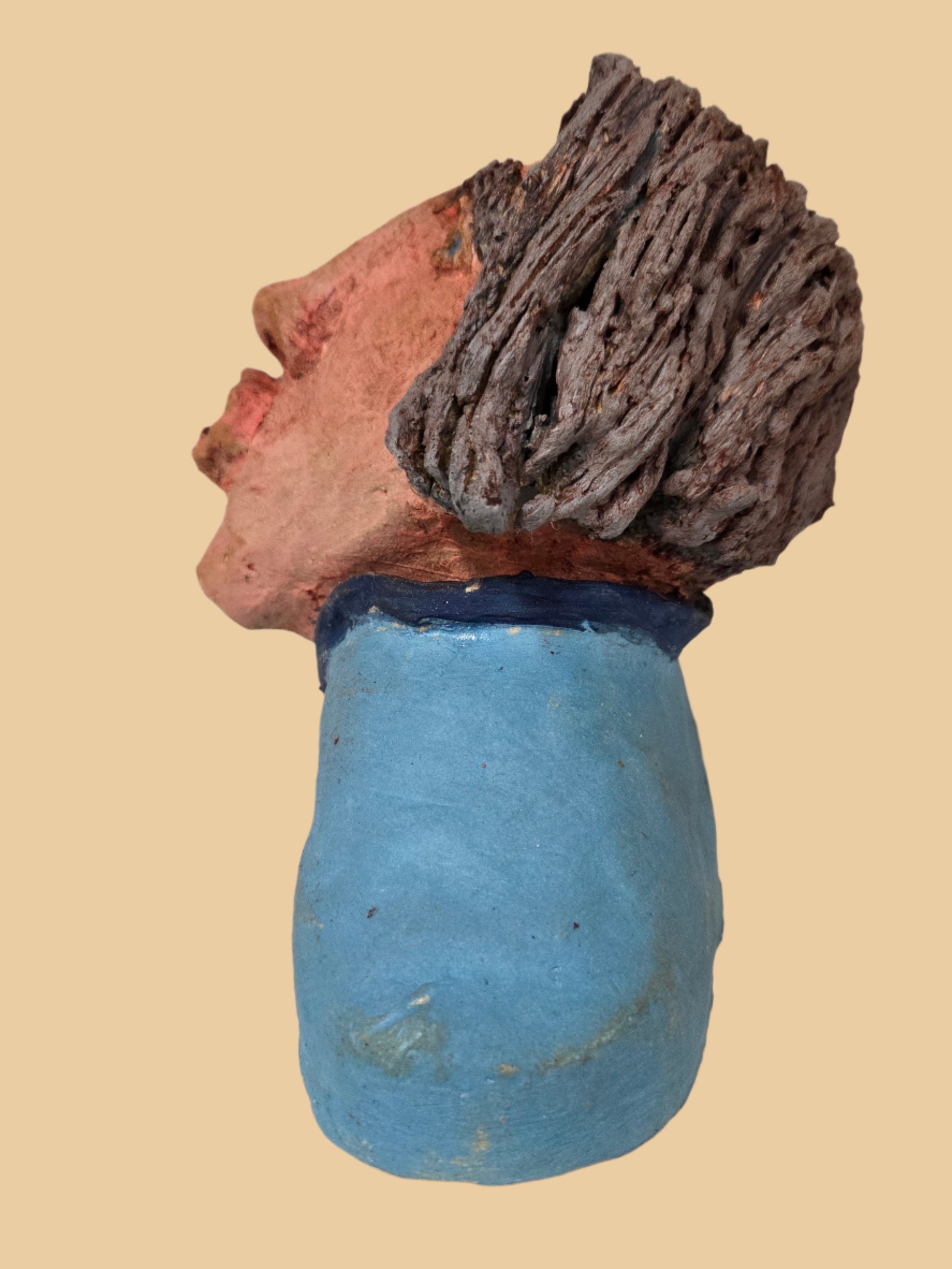 Side view of a an sculpture with grey hair